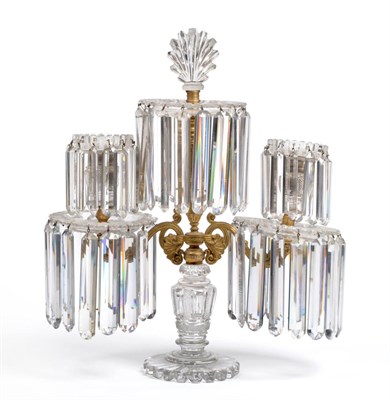 Lot 1013 - A Regency Gilt Bronze and Cut Glass Two-Light Candelabrum, with central foliate finial on stiff...