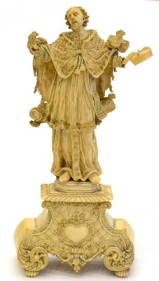 Lot 1020 - An Ivory Figure of a Saint, probably South German, 17th century, wearing flowing robes standing...