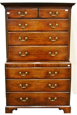 Lot 1058 - A George III Oak Chest on Chest, late 18th century, the dentil cornice above two short and...