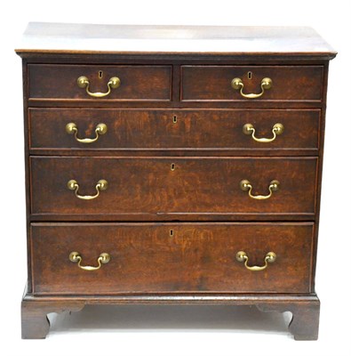 Lot 1062 - A George III Oak Straight Front Chest of Drawers, late 18th century, of two short over three...