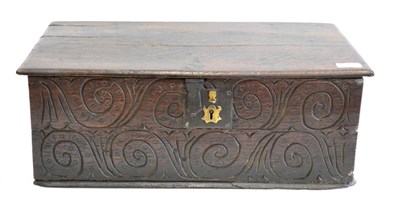 Lot 1065 - A Late 17th Century Carved Oak Box, with hinged lid enclosing a later divider, the front panel with