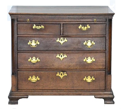 Lot 1069 - A George III Oak Straight Front Chest of Drawers, 3rd quarter 18th century, with pull-out...