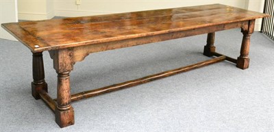 Lot 1070 - An English Joined Oak Refectory Table, the three plank top with cleated ends, raised on turned...