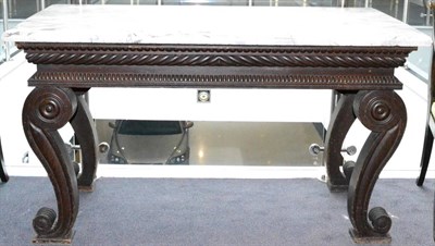 Lot 1087 - A Regency Carved and Stained Pine Console Table, possibly Irish, early 19th century, with a...