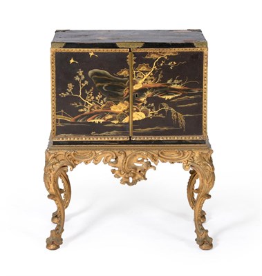 Lot 1096 - An 18th Century Japanned Cabinet on Stand, the cabinet with engraved brass corner brackets,...