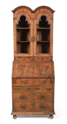 Lot 1116 - A George I Walnut Double Dome Top Bureau Bookcase, the upper section with two glazed doors...