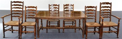 Lot 1121 - An 18th Century English Oak Dining Table, of four plank construction with cleated ends, raised...