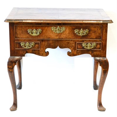 Lot 1124 - A George II Walnut Dressing Table, circa 1750, the quarter-veneered and crossbanded top above a...