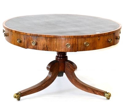 Lot 1127 - A Regency Rosewood Circular Library Drum Table, early 19th century, the brown leather skiver...