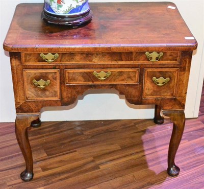 Lot 1138 - An 18th Century Walnut and Feather Banded Dressing Table, the crossbanded and quarter-veneered...