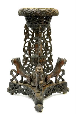 Lot 1141 - An Anglo-Indian Carved Hardwood Planter, late 19th century, foliate carved throughout with baluster