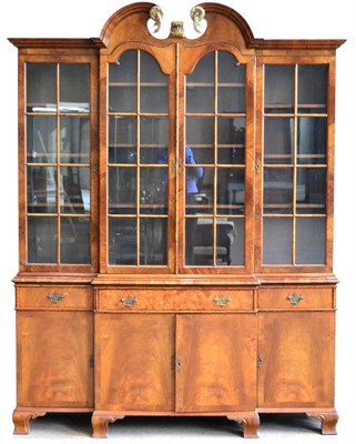 Lot 1161 - A George II Style Walnut Breakfront Bookcase, late 19th/early 20th century, the broken swan...