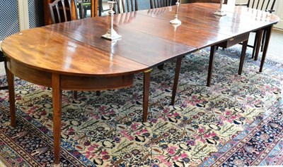 Lot 1164 - A George III Mahogany D End Dining Table, circa 1800, with three additional leaves and a centre...