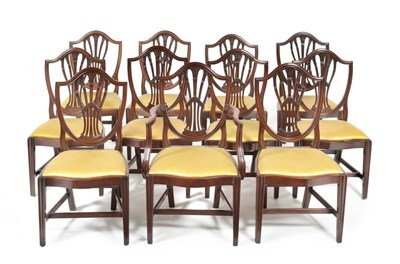 Lot 1170 - A Set of Eleven George III Mahogany Shield Back Dining Chairs, late 18th century, with yellow...