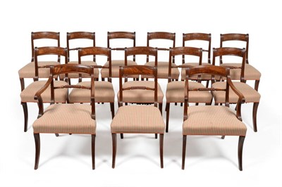 Lot 1171 - A Set of Fourteen Mahogany and Ebony Strung Dining Chairs, early 19th century, with curved top...