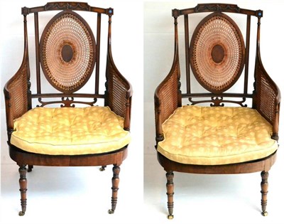 Lot 1178 - A Pair of 19th Century Mahogany Bergères, the oval back supports above a squab cushion between...