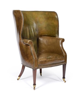 Lot 1182 - A George III Barrel Shape Wingback Armchair, early 19th century, upholstered in green...