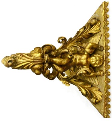 Lot 1186 - A 19th Century Carved Giltwood Wall Bracket, the triangular platform top supported by a cherub...