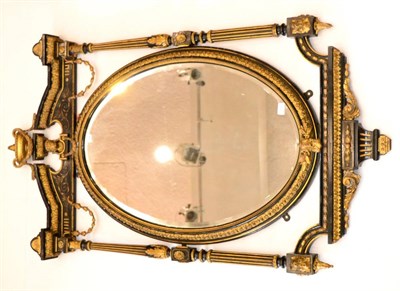 Lot 1202 - A Late Victorian Ebonised and Gilt Gesso Overmantel Mirror, circa 1870, the oval bevelled glass...