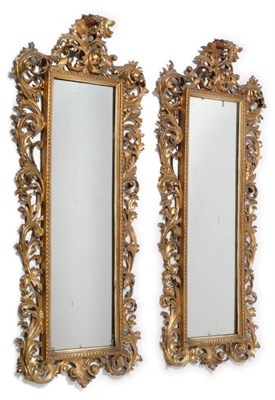 Lot 1206 - A Pair of Carved Giltwood Rectangular Wall Mirrors, with mirror plates within a beaded frame...