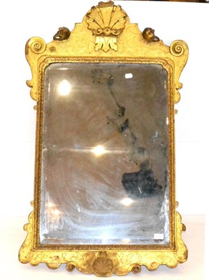 Lot 1207 - A George I Giltwood and Gesso Pier Glass, the bevelled glass plate contained within a rockwork...