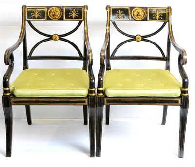 Lot 1211 - A Pair of Regency Simulated Rosewood and Parcel Gilt Armchairs, early 19th century, the curved...