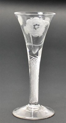 Lot 6 - A Jacobite Wine Glass, circa 1750, the trumpet bowl engraved with a rose on an air twist stem,...