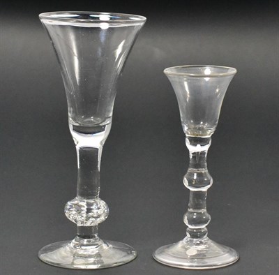 Lot 12 - A Balustroid Wine Glass, circa 1740, the bell shaped bowl on a plain stem, the basal knop with...