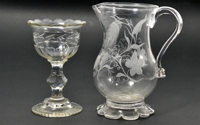 Lot 14 - A Glass Ale Jug, circa 1760, of baluster form, engraved with initials T/I.I. within hops and barley