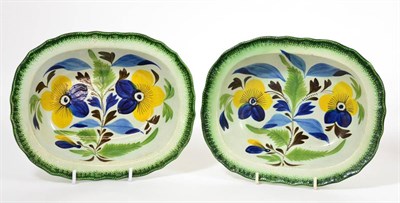 Lot 35 - A Pair of Creamware Bowls, circa 1800, of oval form, painted with stylised pansies within...