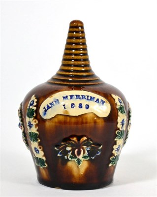 Lot 64 - A Measham Bargeware Money Box, dated 1889, of ovoid form with ribbed finial, inscribed JANE...
