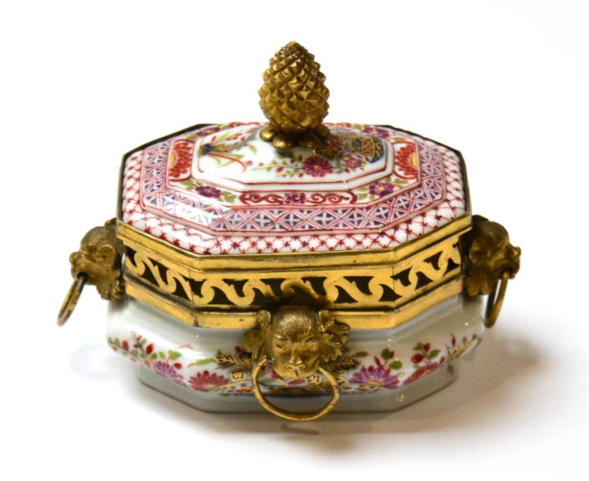 Lot 80 - A Meissen Porcelain Sugar Box and Cover, circa 1735, painted in Imari type colours with chinoiserie
