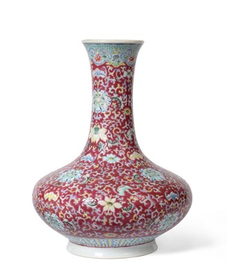 Lot 102 - A Chinese Porcelain Bottle Vase, bears Qianlong reign mark, painted in famille rose enamels...