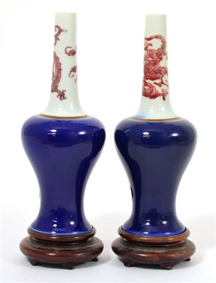 Lot 110 - A Pair of Chinese Porcelain Bottle Vases, of baluster form, the tall tapering necks painted in...