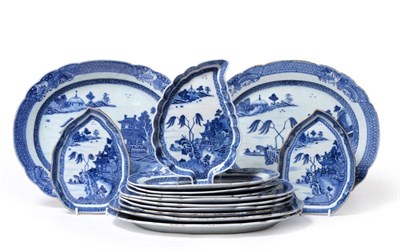 Lot 117 - A Chinese Porcelain Dinner Service, Qianlong, painted in underglaze blue with a river landscape...
