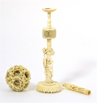 Lot 125 - A Chinese Ivory Puzzle Ball and Stand, 19th century, the ball typically carved with writhing...