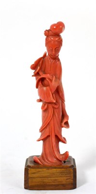 Lot 129 - A Chinese Carved Coral Figure of a Maiden, early 20th century, standing in flowing robes...