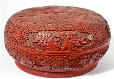 Lot 134 - A Chinese Cinnabar Lacquer Circular Box and Cover, Qing Dynasty, carved with figures in a...