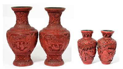 Lot 135 - A Pair of Chinese Cinnabar Lacquer Vases, 19th century, of baluster form carved with figures in...