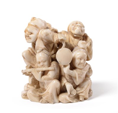 Lot 139 - A Japanese Ivory Netsuke, Meiji period, signed Somei, as a group of musicians, incised...