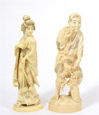 Lot 142 - A Japanese Ivory Okimono, Meiji period, as a man in traditional dress smoking a pipe, holding a...