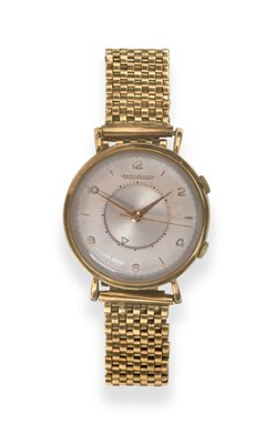 Lot 169 - A 9ct Gold Centre Seconds Alarm Wristwatch, signed Jaeger LeCoultre, model: Memovox, 1953, (calibre