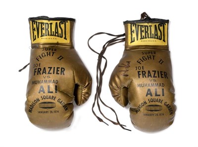 Lot 2006 - Pair of Ali vs Frazier 1974 Commemorative Boxing Gloves, gold coloured gloves, inscribed 'Super...