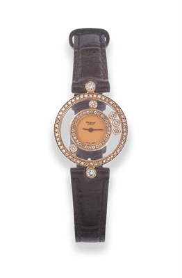 Lot 171 - A Lady's 18ct Gold Diamond Set Wristwatch, signed Chopard, model: Happy Diamonds, circa 2000,...