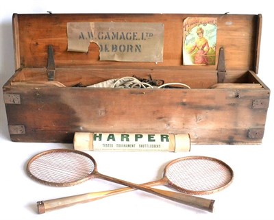 Lot 2013 - A Cased Badminton Set with Gamages Label, containing posts, net, four rackets and a tube of...