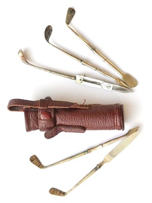 Lot 2017 - A Silver Handled Manicure Set in the Form of Golf Clubs in a Leather Golf Bag, five sterling silver