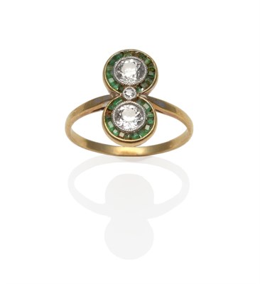 Lot 201 - An Art Deco Diamond and Emerald Ring, two adjoining clusters set vertically, each with an old...