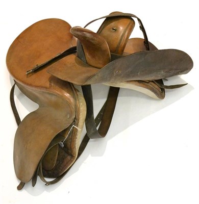 Lot 2050 - A Leather Side Saddle by Owen & Co., London, serial number 3696, with girth strap and rain cover