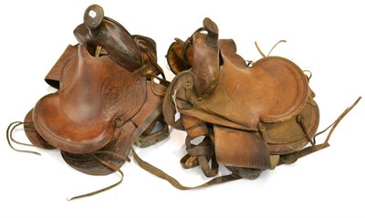 Lot 2056 - A ";Cow Country"; Leather Western Saddle, the pommel, cantle and saddle flaps tooled to...