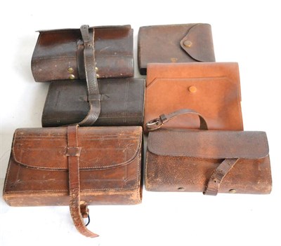 Lot 2126 - Two Large Stitched Leather Fly Wallets, with leather straps, one by James Greg of Blackburn...